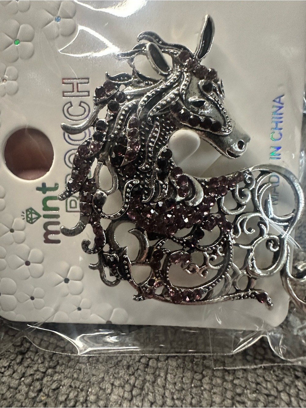 Mint silver-tone filigree horse pin with purple stones